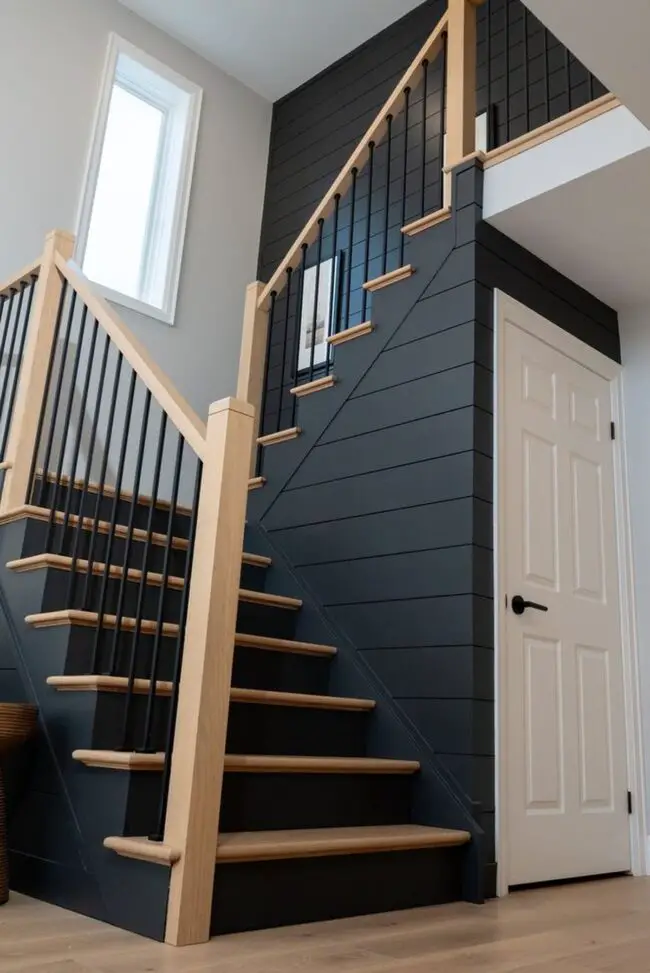 Bold Staircase with Dark Accent Wall