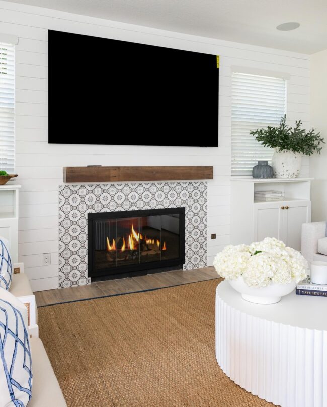 Black and White Patterned Tiles with Rustic Mantel