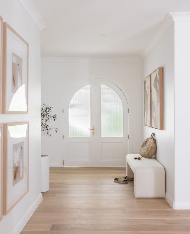 Minimalist Entry with Arched Doors