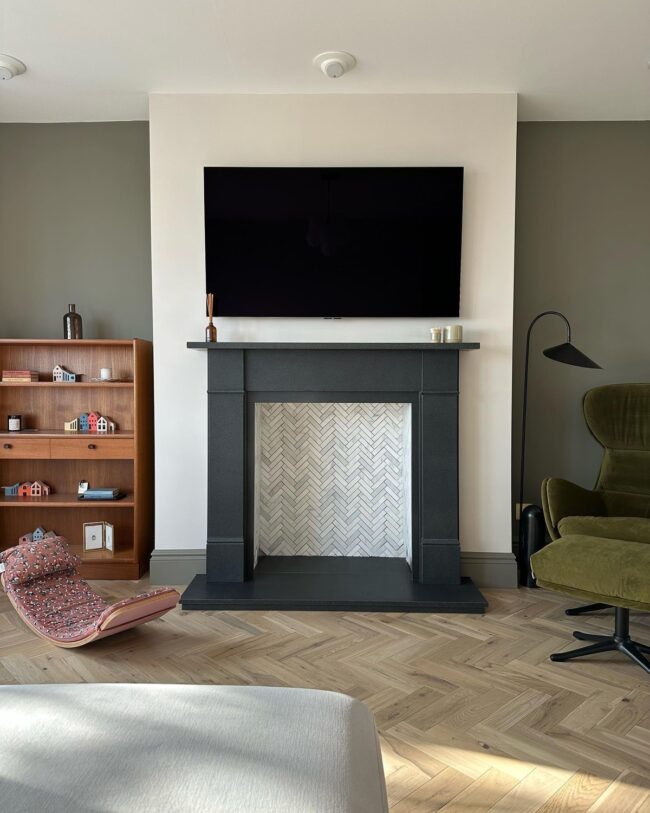 Black Slate Mantel with Herringbone Tile Surround